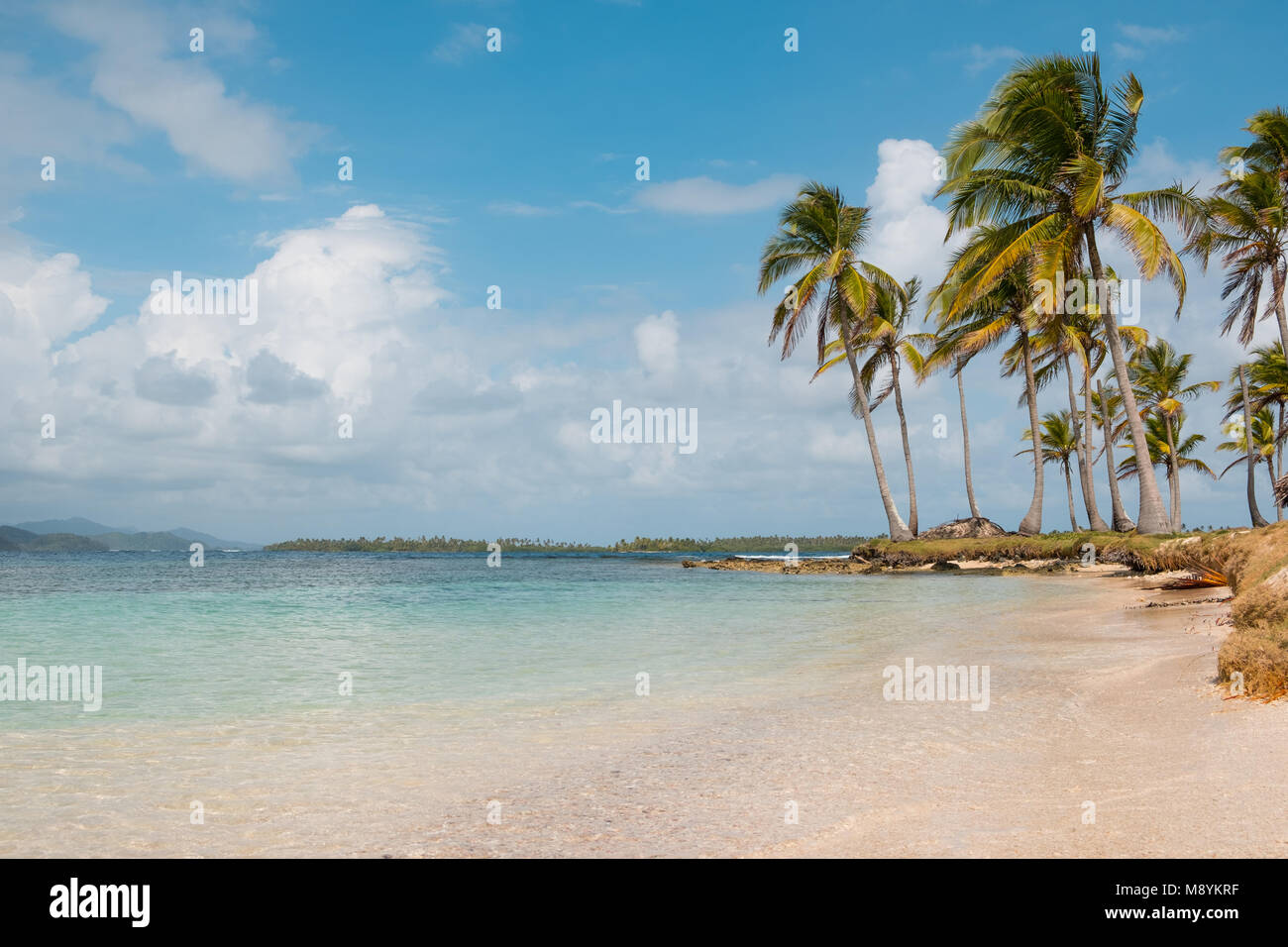 white sand beach, palm trees and turquoise water  - Caribbean Ocean - San Blas Islands Panama Stock Photo