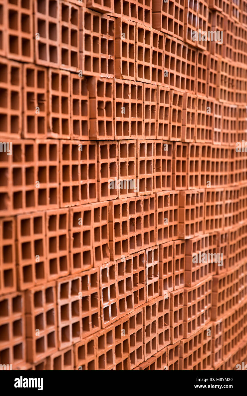 View at pile of bricks with holes Stock Photo