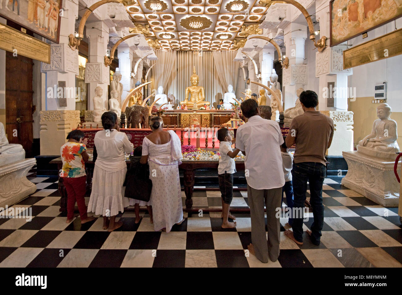 Shrine inside the Temple of the tooth relic where people offer flowers