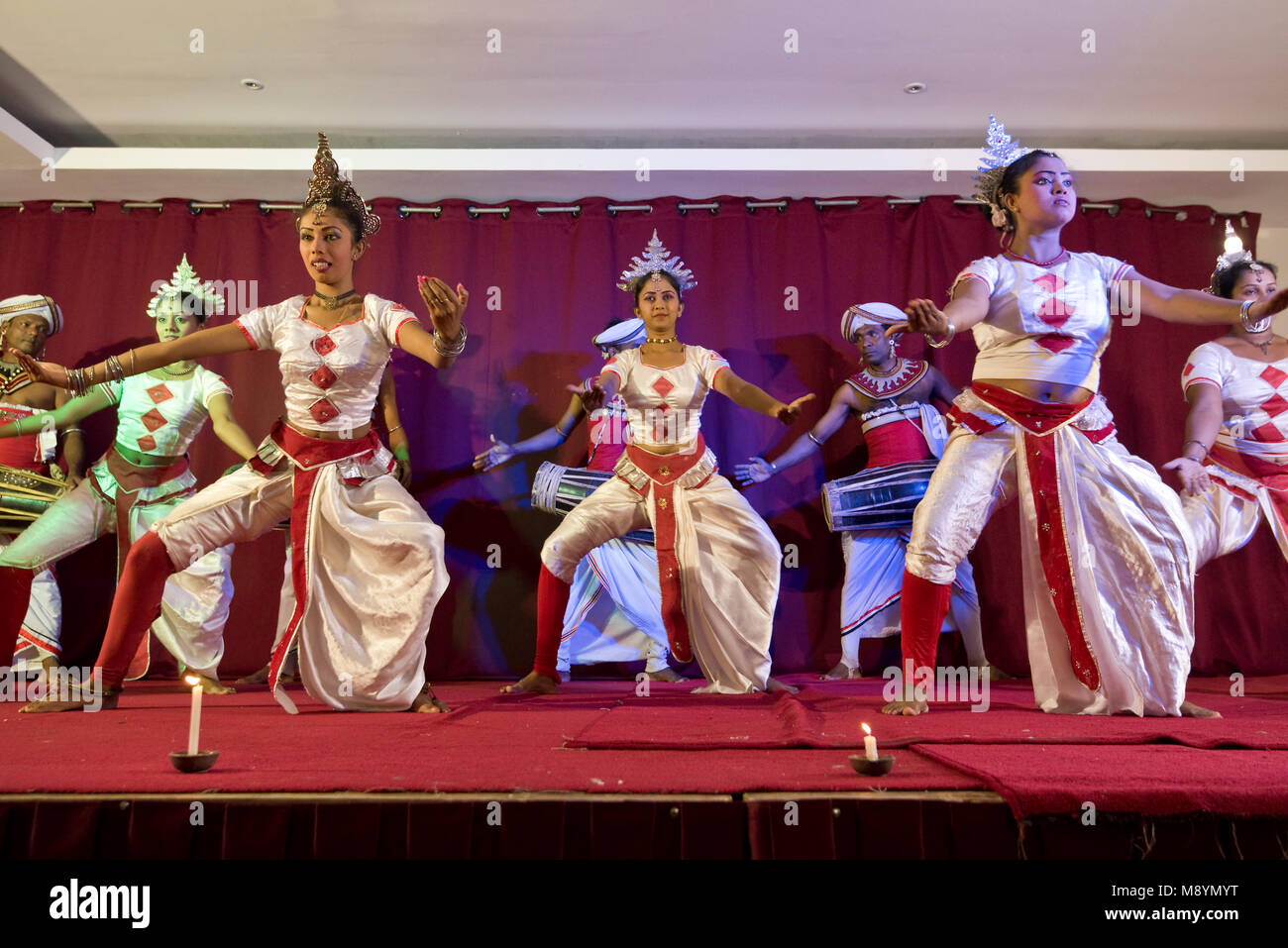 Traditional colourful costumes Sri Lankan dancers and musicians at a  display. Slow shutter speed so motion blur Stock Photo - Alamy