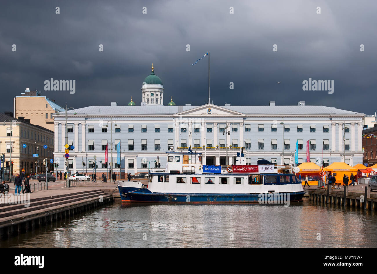 HELSINKI, FINLAND - APRIL 23, 2016: Floating cafe in harbor near Market Square (Kolera-allas; Cholera Basin). Stock Photo