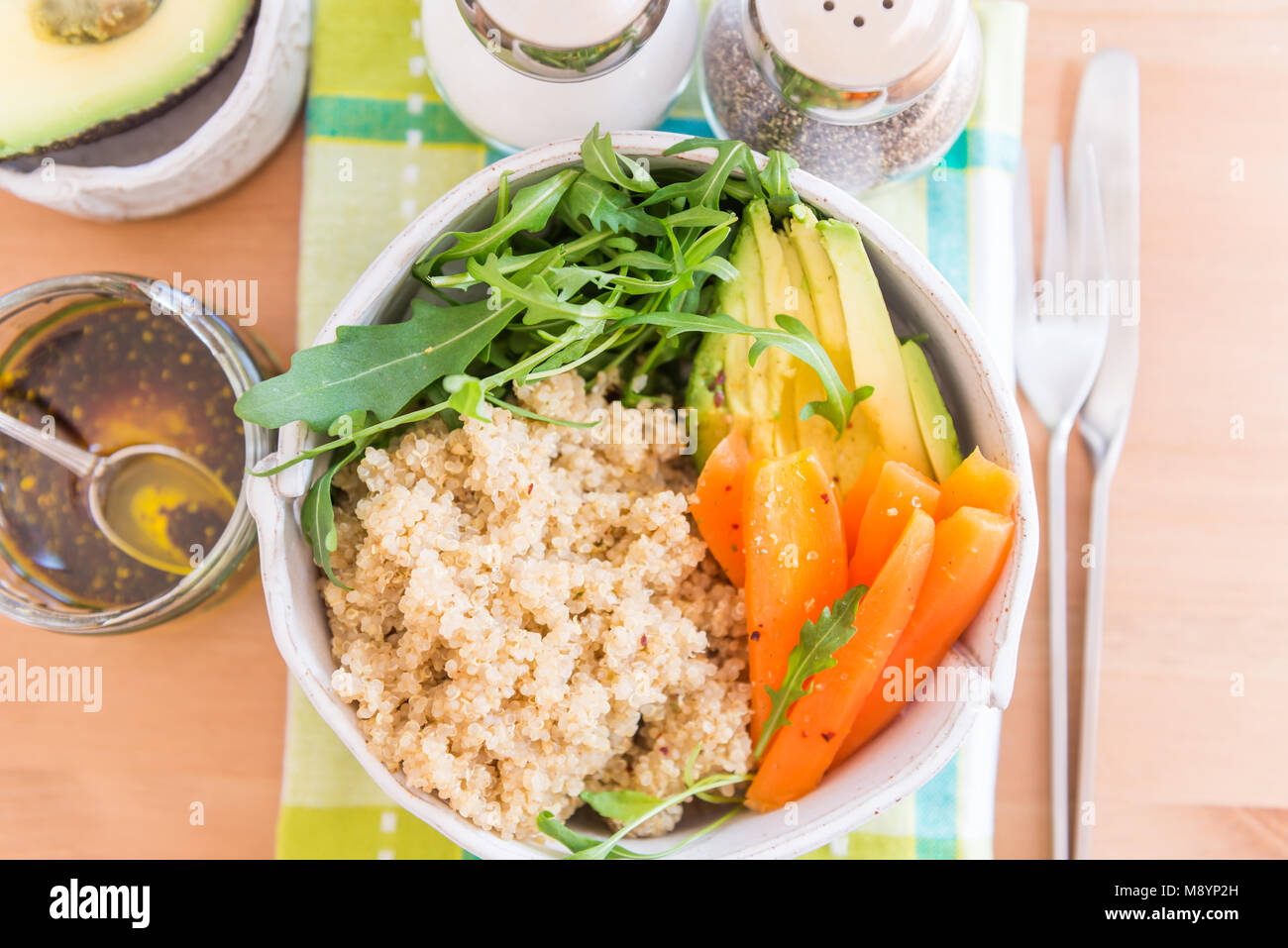 Healthy Detox Dinner with Quinoa, Carrots, Avocado and Rocket salad