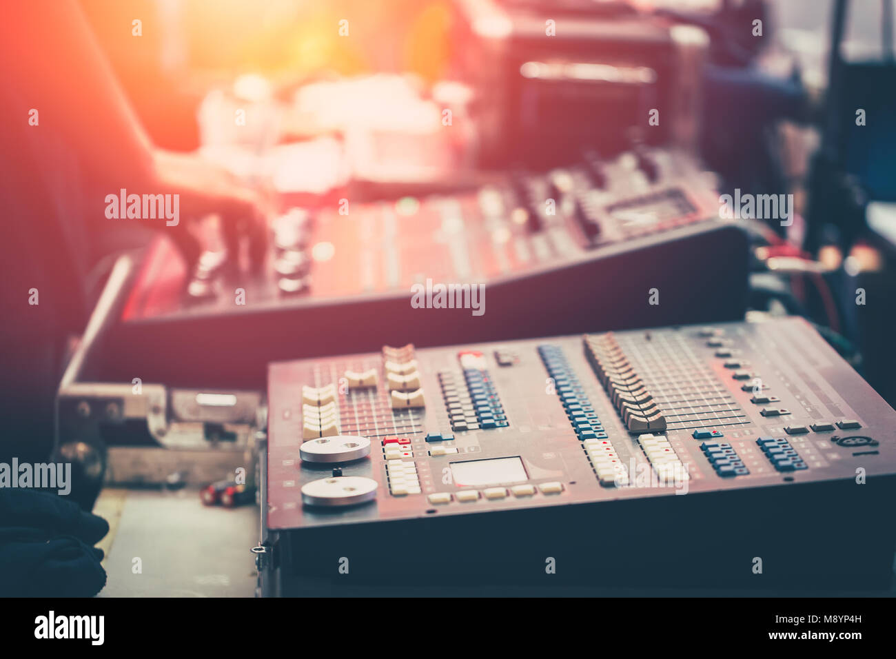professional stage sound mixer closeup at sound engineer hand using
