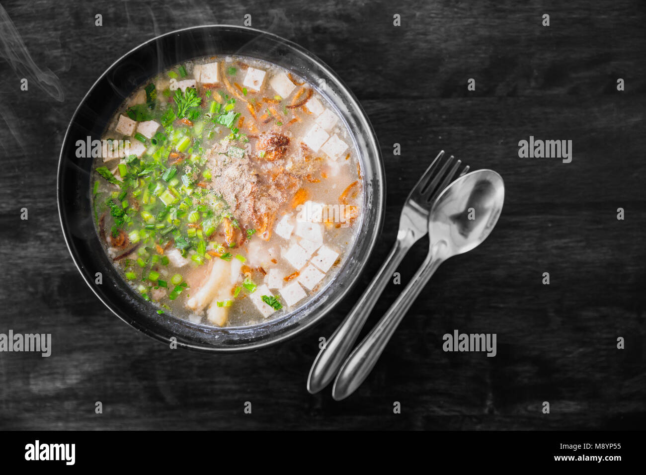 Vietnamese noodle soup pho with herbal vegetrable recipe served on wooden table Stock Photo