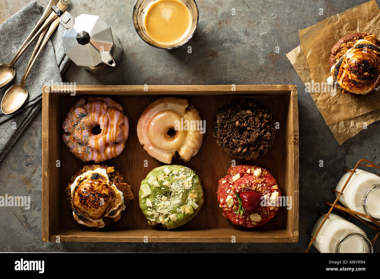Variety of donuts in a wooden box Stock Photo - Alamy