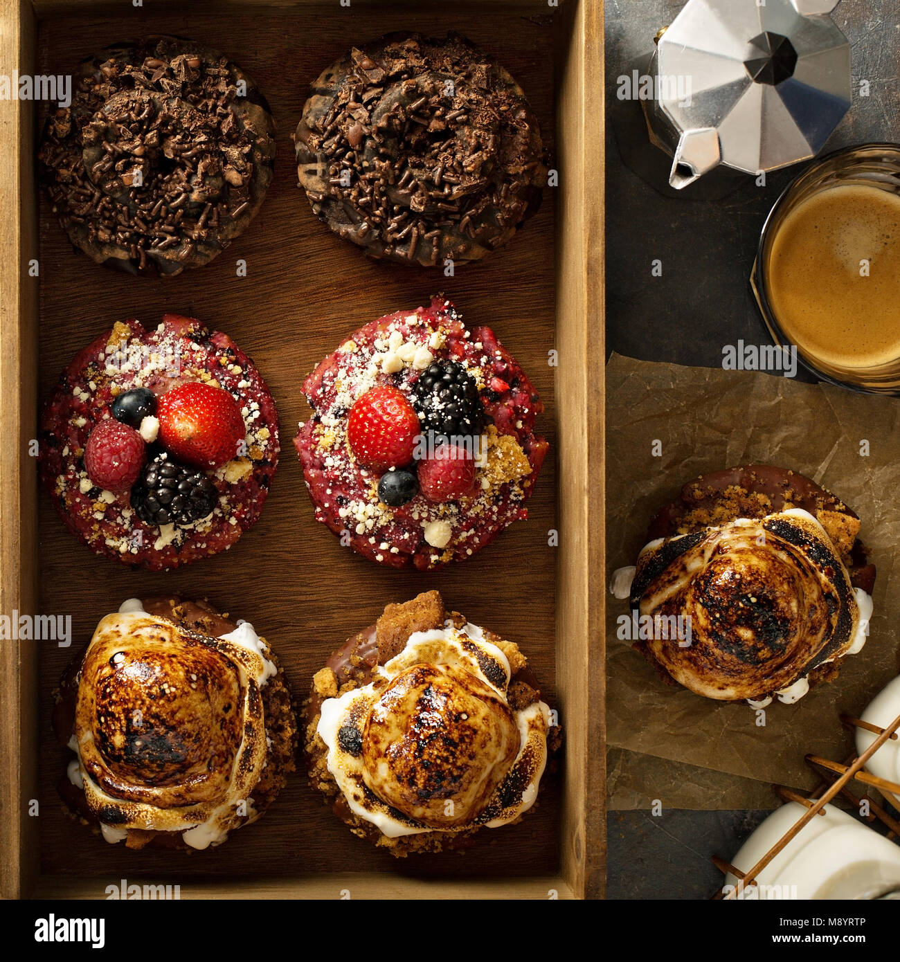 Variety of donuts in a wooden box Stock Photo - Alamy