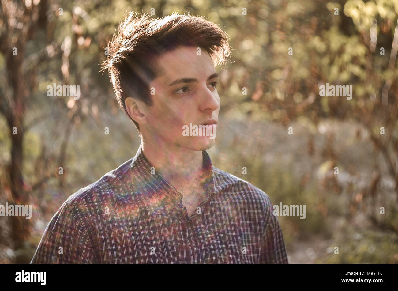 Portrait of serious thoughtful teenage boy outdoors Stock Photo