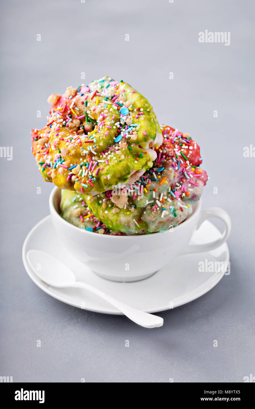 Unicorn donuts in a cup Stock Photo