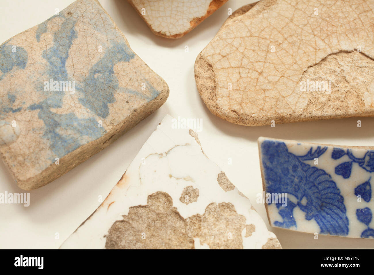 Broken pottery shards on a tabletop Stock Photo Alamy