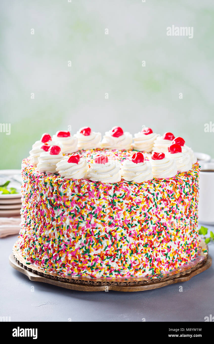Birthday cake covered in sprinkles Stock Photo Alamy