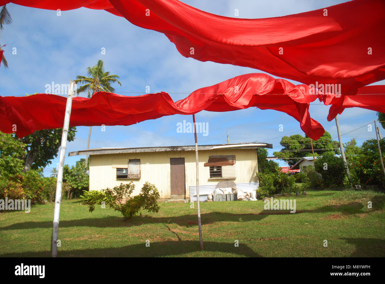 Red sheets drying on a washing line, Rakiraki, Fiji Stock Photo Alamy