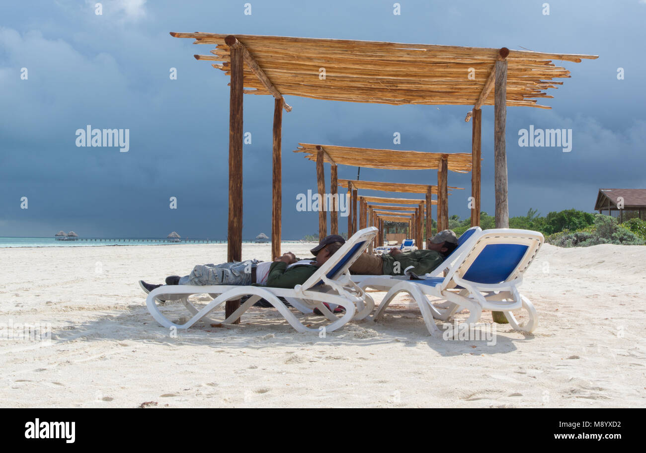 Cuban Workforce taking a well deserved rest from building the Sun Shades Stock Photo