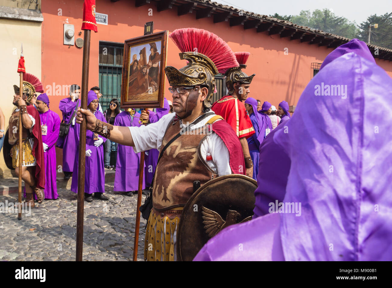 Antigua, Guatemala: March 18 2018: Man with roman soldier costume standing at the procession of San Bartolome de Becerra in 1a Avenida Stock Photo