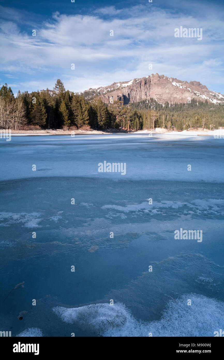 A frozen Silver Lake with Thunder Mountain in the background in Kit Carson, Eldorado National Forest, California, USA. Stock Photo