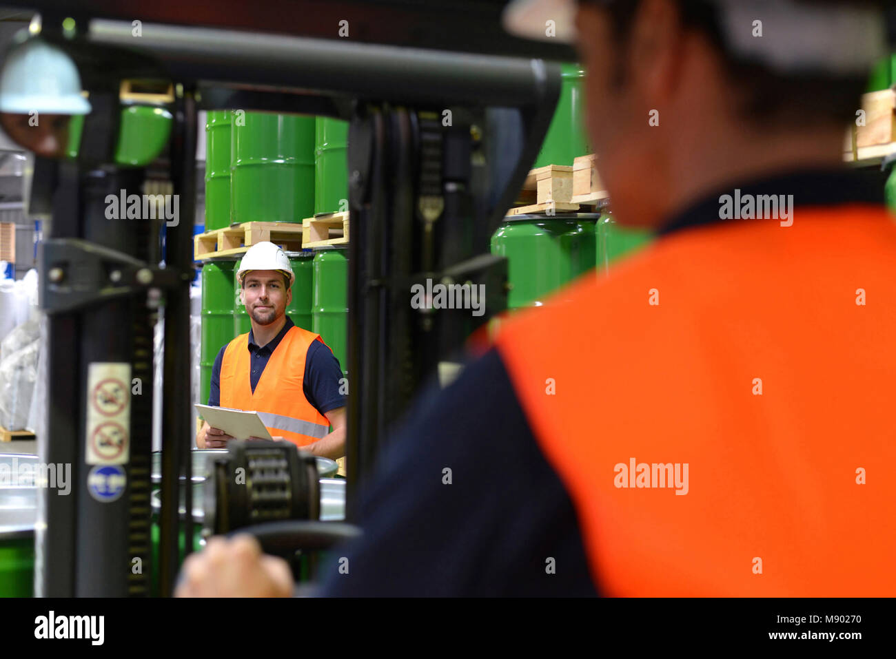 group of workers in the logistics industry work in a warehouse with