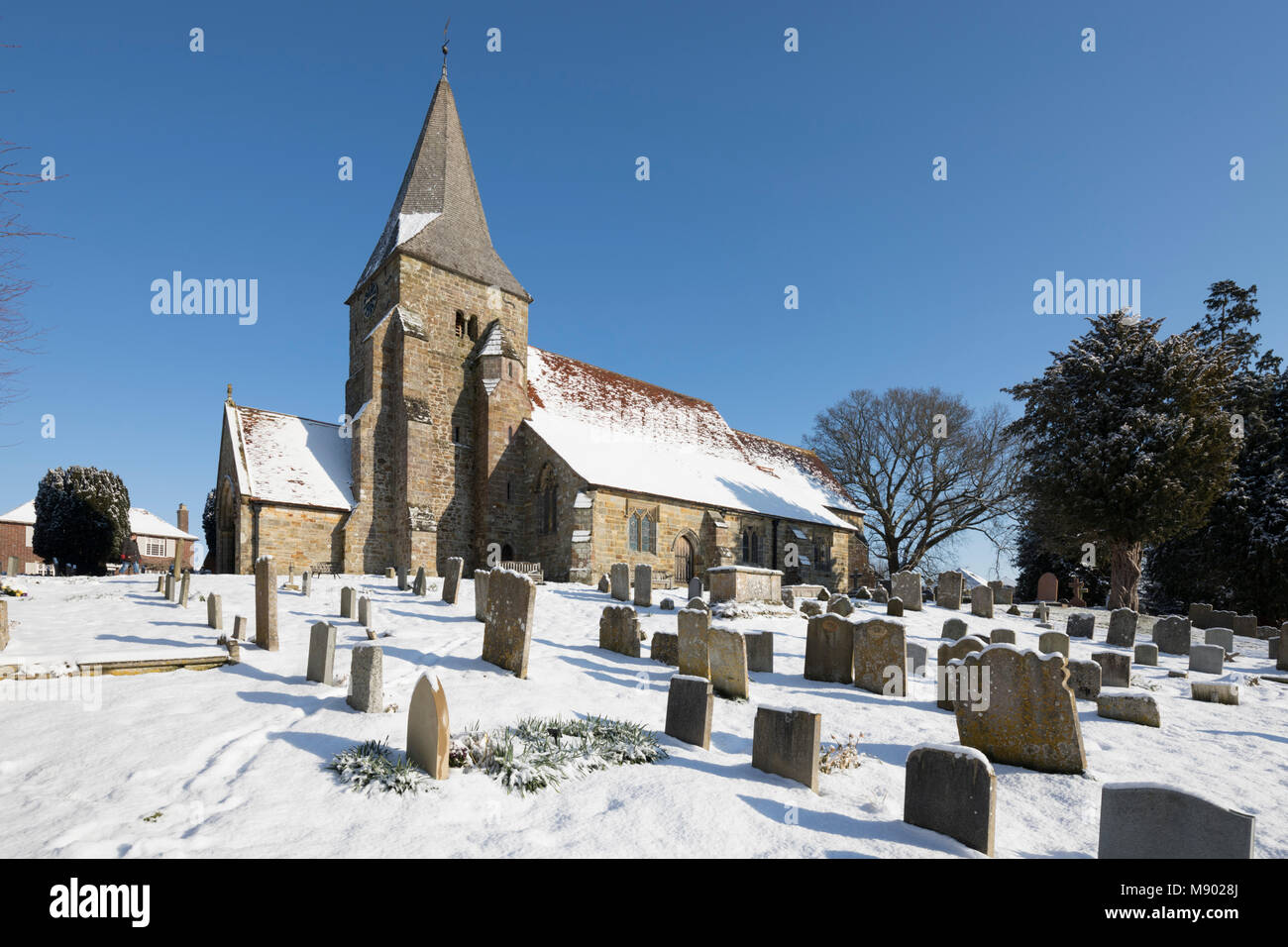St. Bartholomew's church in snow, Burwash, East Sussex, England, United Kingdom, Europe Stock Photo