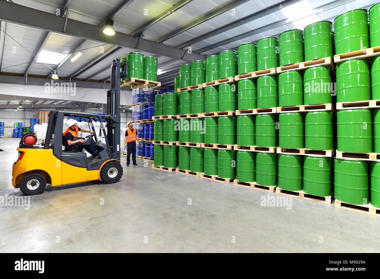 group of workers in the logistics industry work in a warehouse with