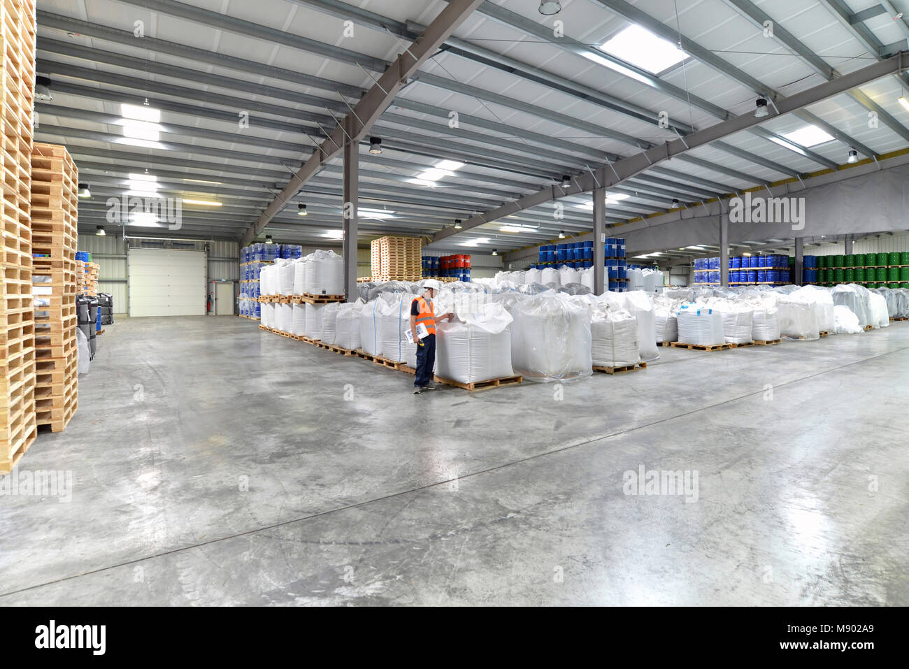 group of workers in the logistics industry work in a warehouse with