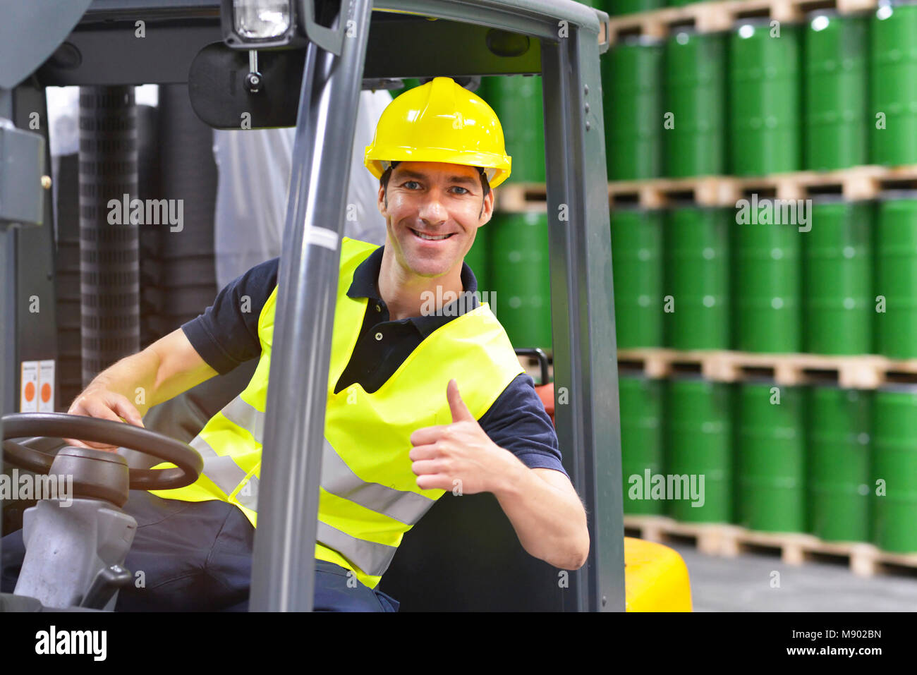 forklift driver in a logistics hall of a chemical warehouse Stock Photo