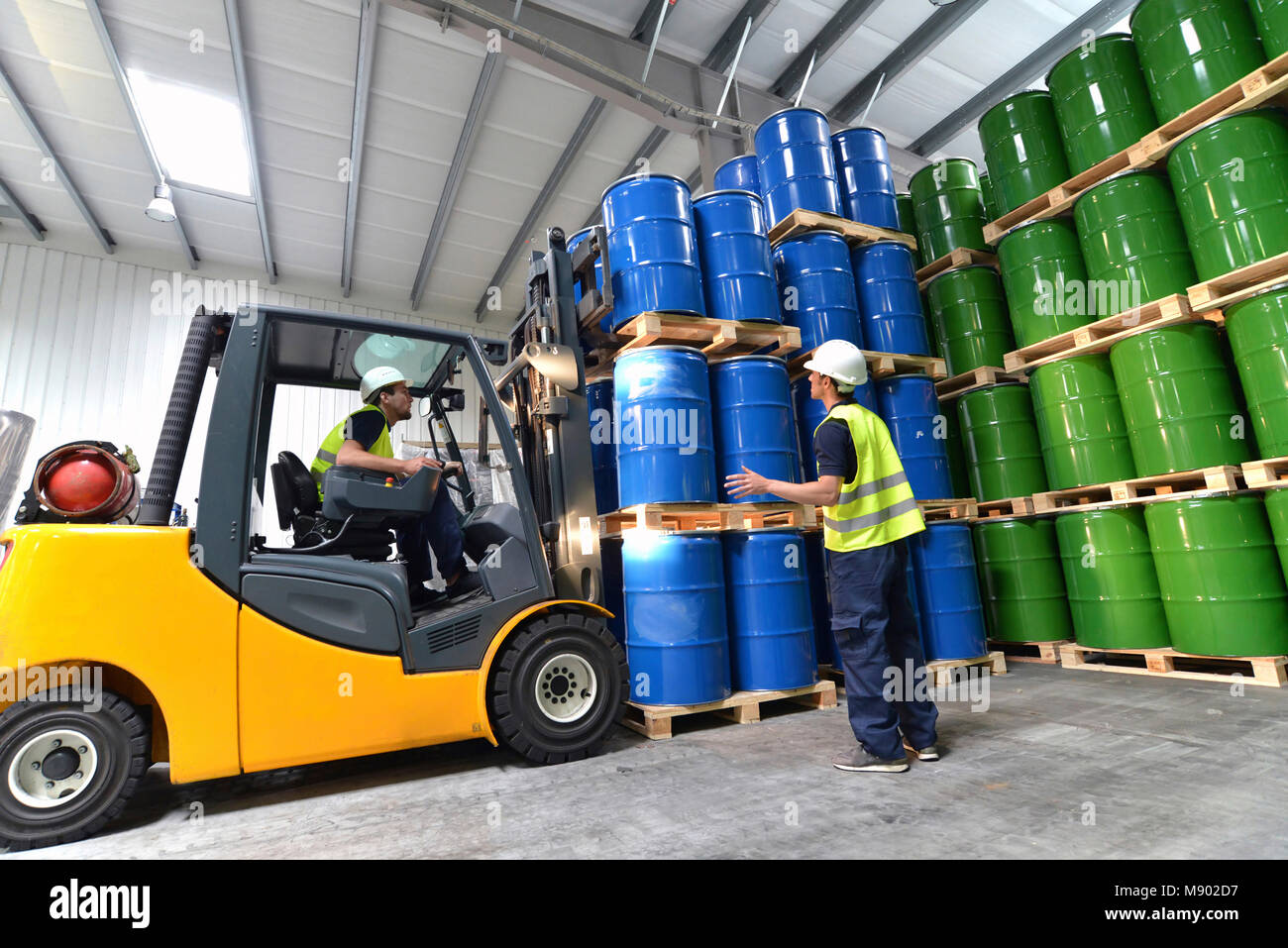 group of workers with forklift in the logistics industry working in a