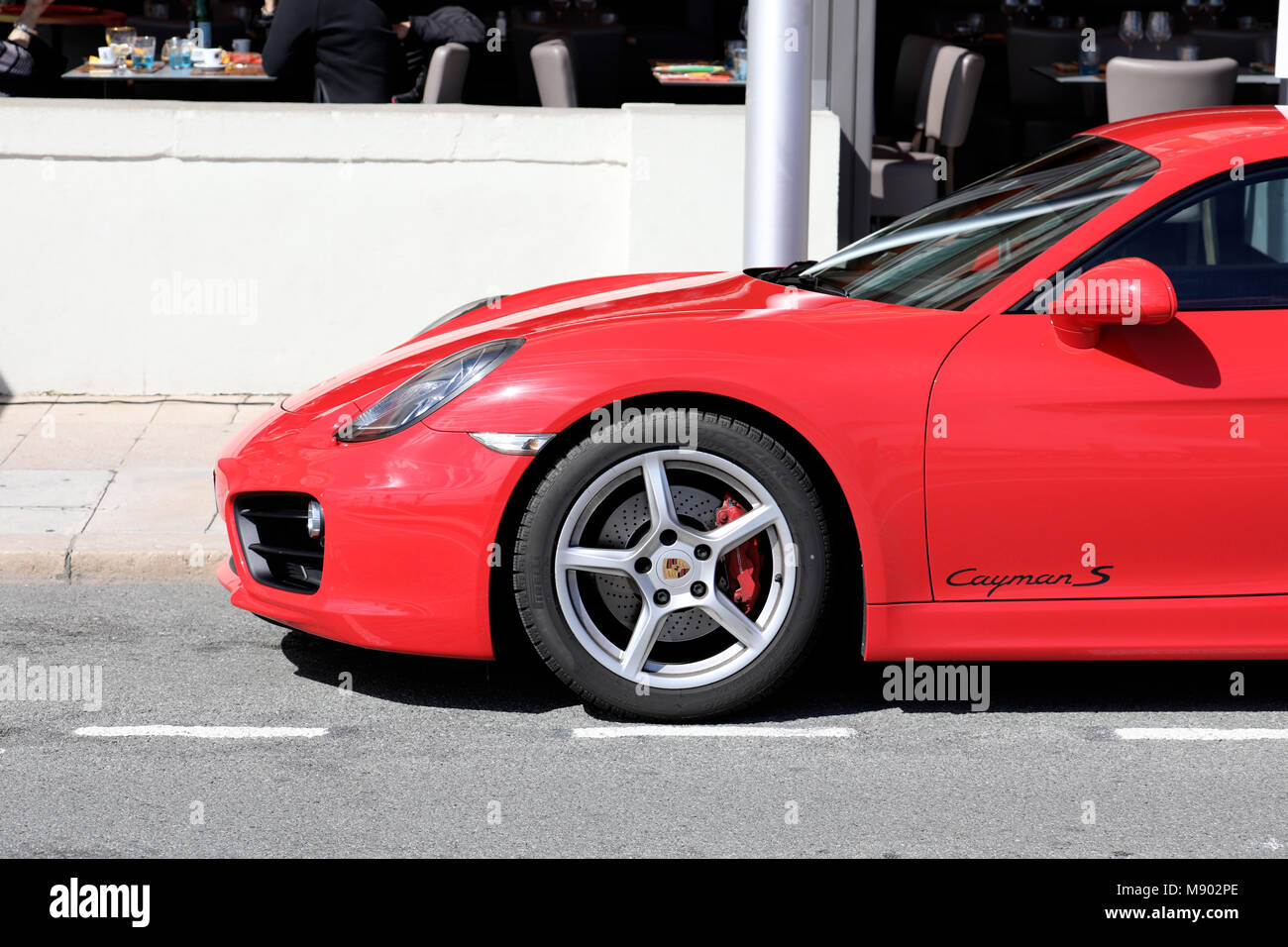 Menton, France - March 19, 2018: Luxury Red Porsche 718 Cayman S (Side View) Parked In The Street Of Menton On The French Riviera Stock Photo