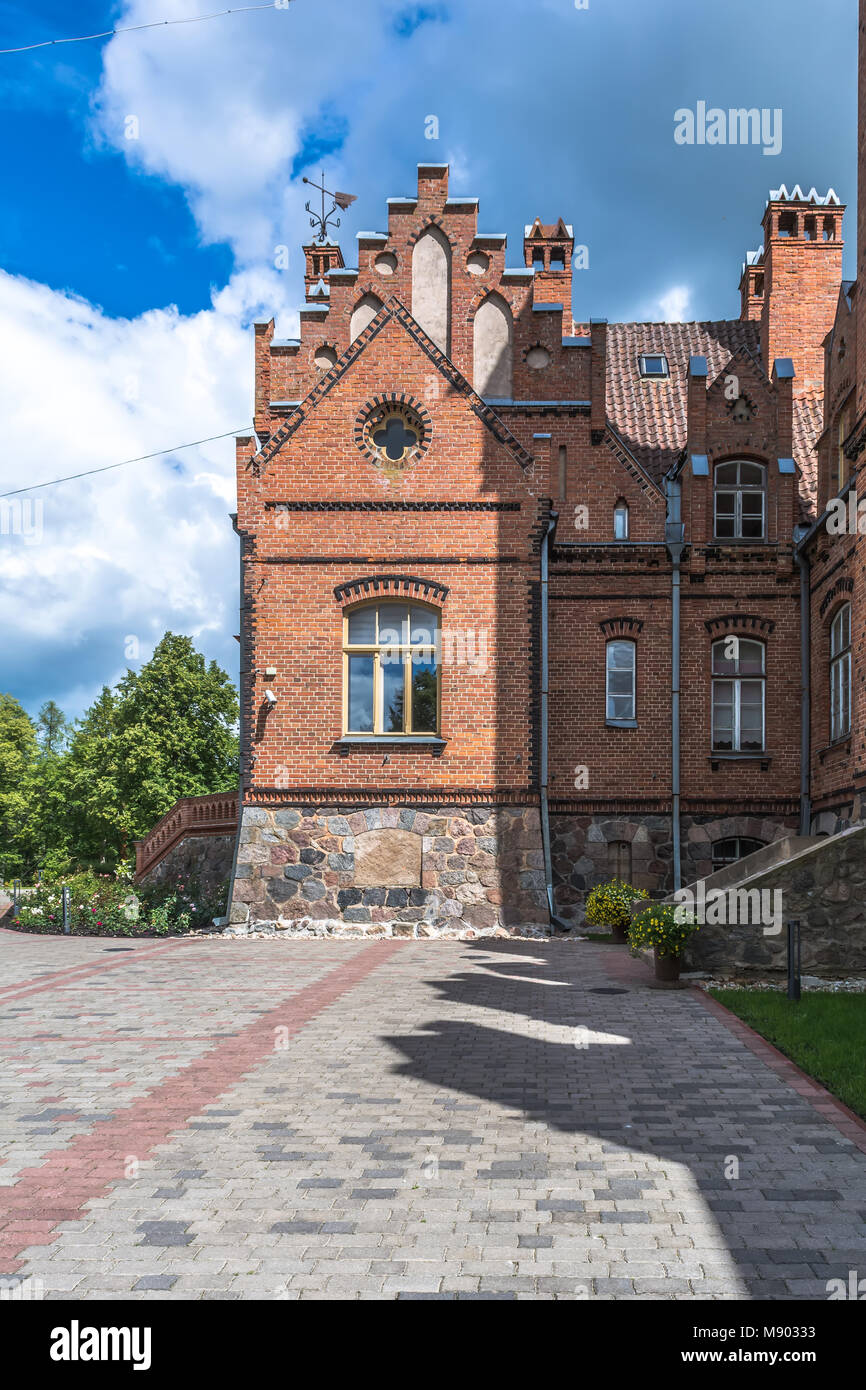 Red neo gothic palace in Latvia Stock Photo
