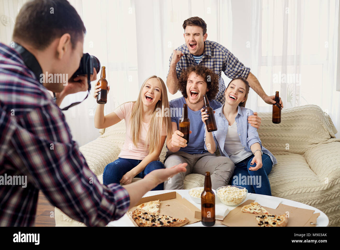 A group of friends are photographed on a camera. Stock Photo