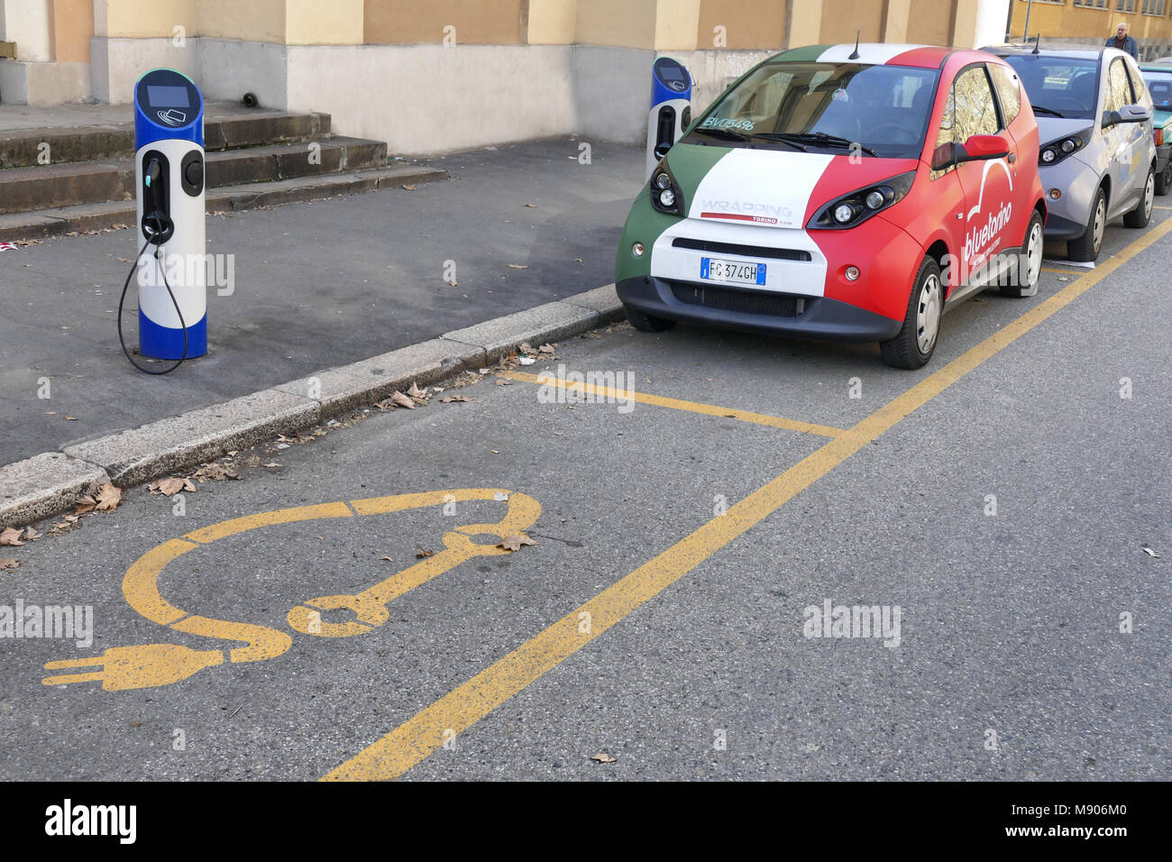 Electric car sharing at charging station wrapped in vinyl italian flag