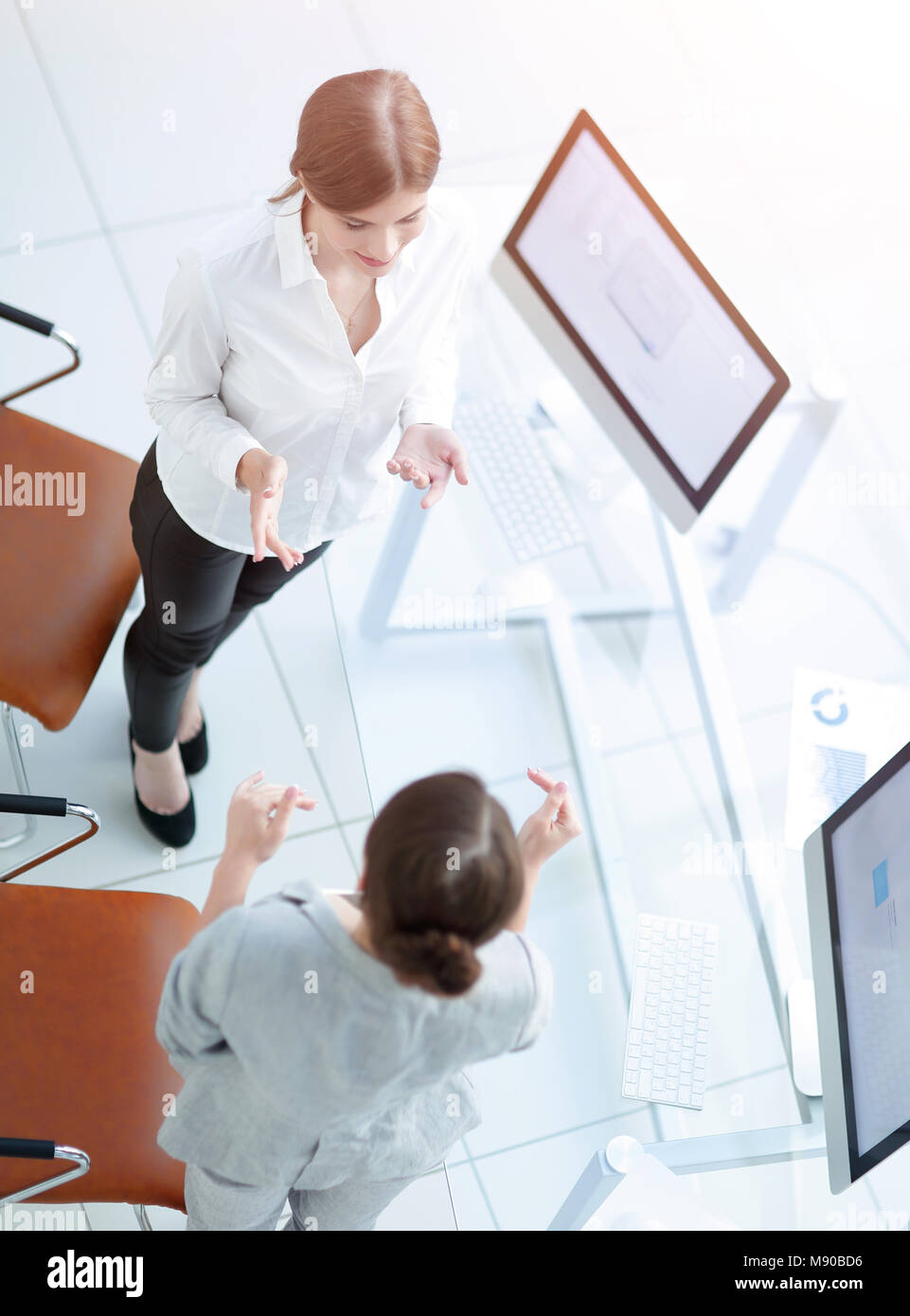 two women colleagues discuss a work problem. business concept Stock ...
