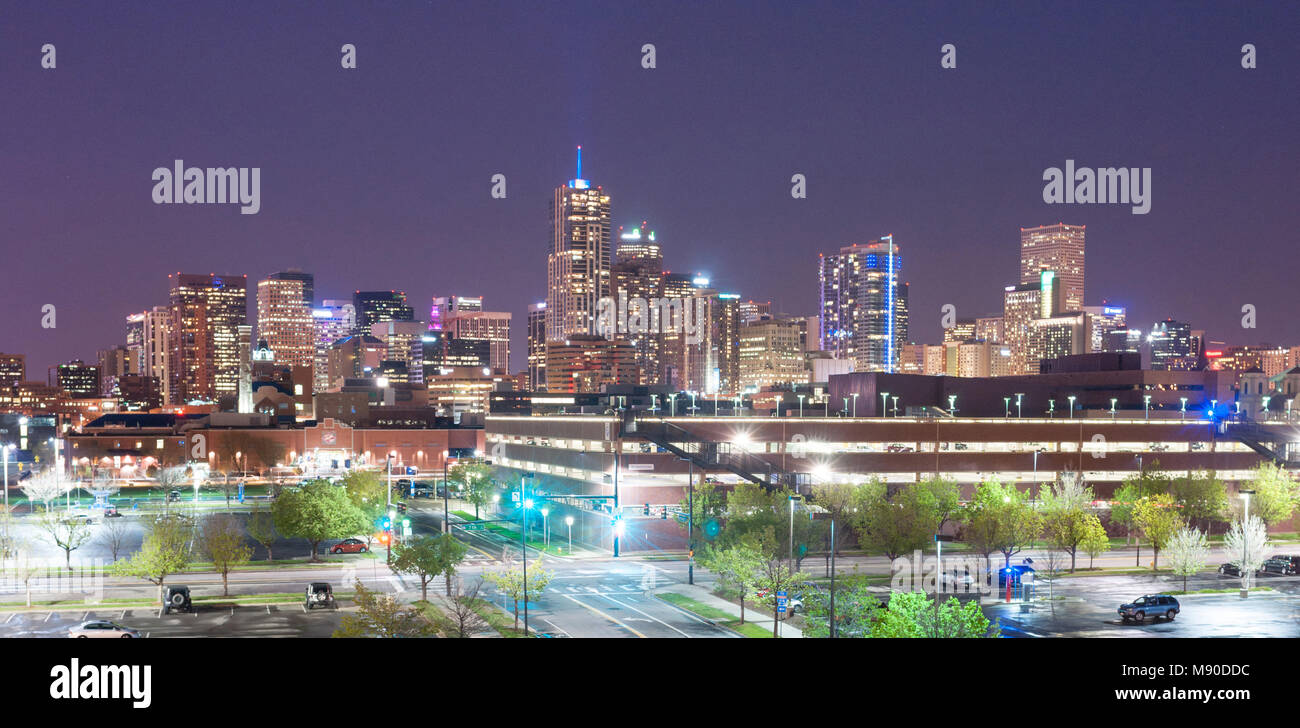 Tungsten light throws blue light on the parking lot in Denver Colorado at night Stock Photo