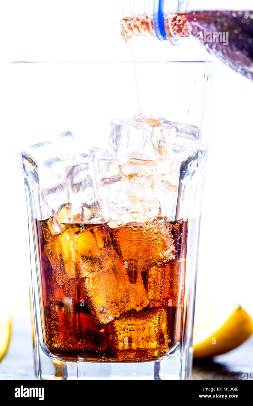 Cold cola drink with bubbles and ice cubes Stock Photo Alamy