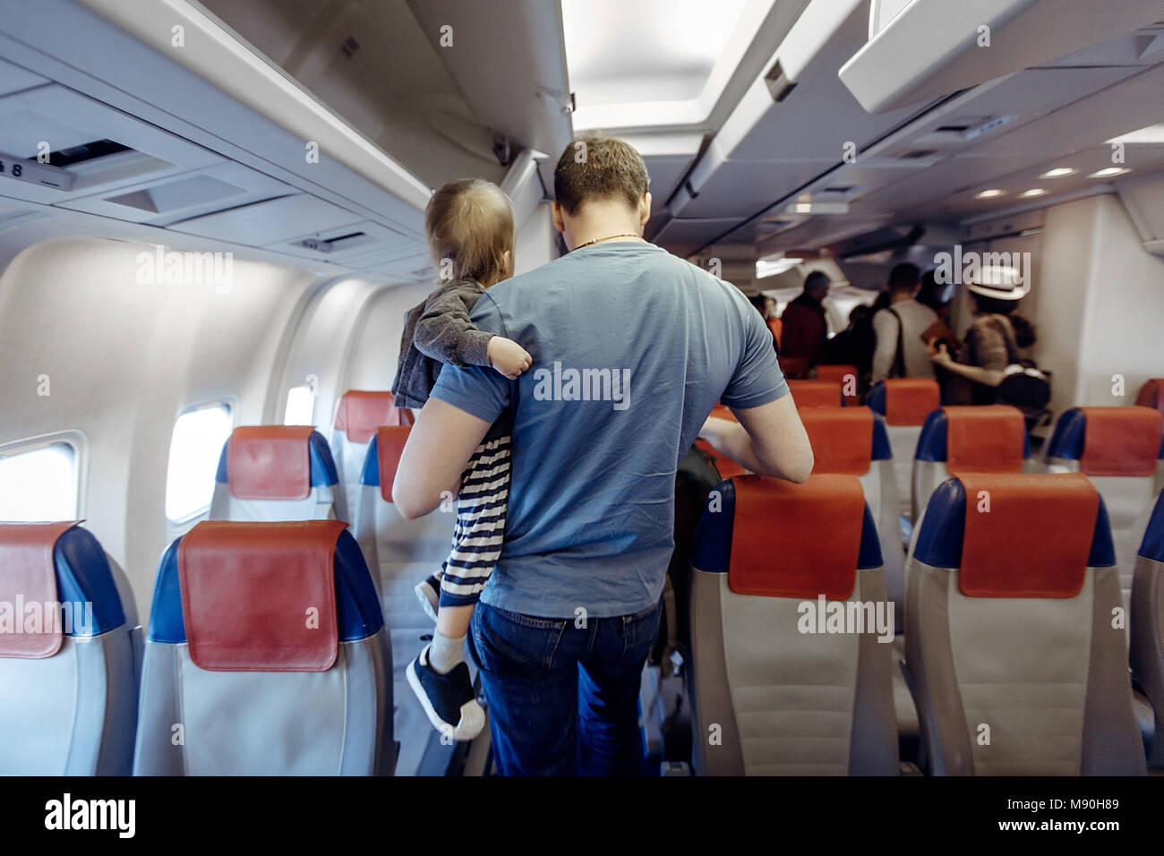 Father with child in airplane Stock Photo