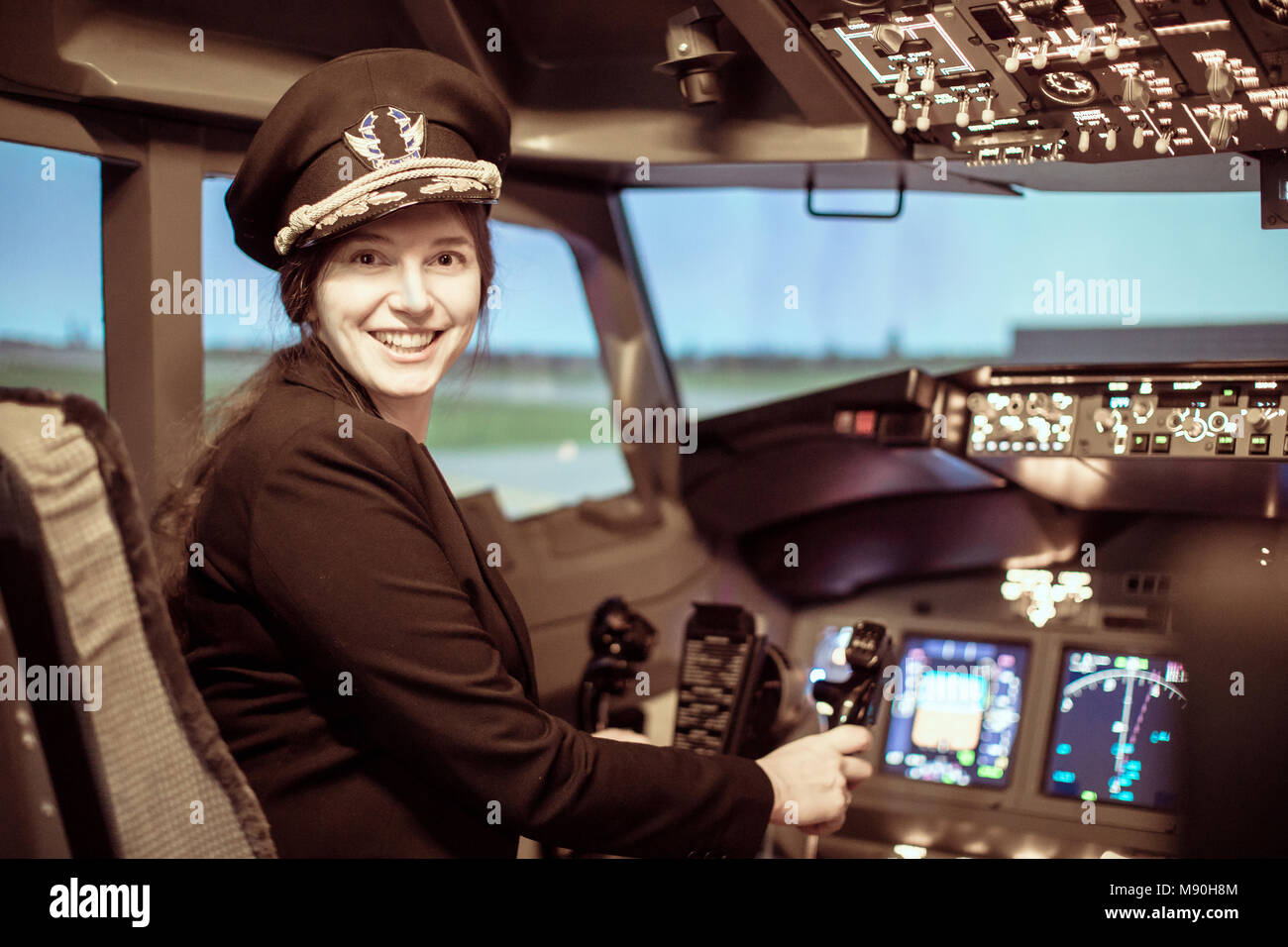 Beautiful woman pilot wearing uniform Stock Photo