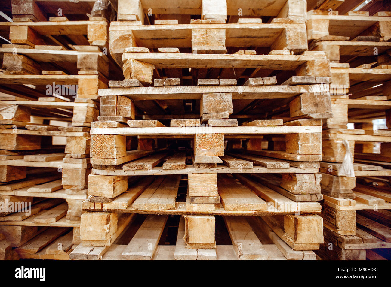 Wooden pallets stacked a warehouse Stock Photo Alamy
