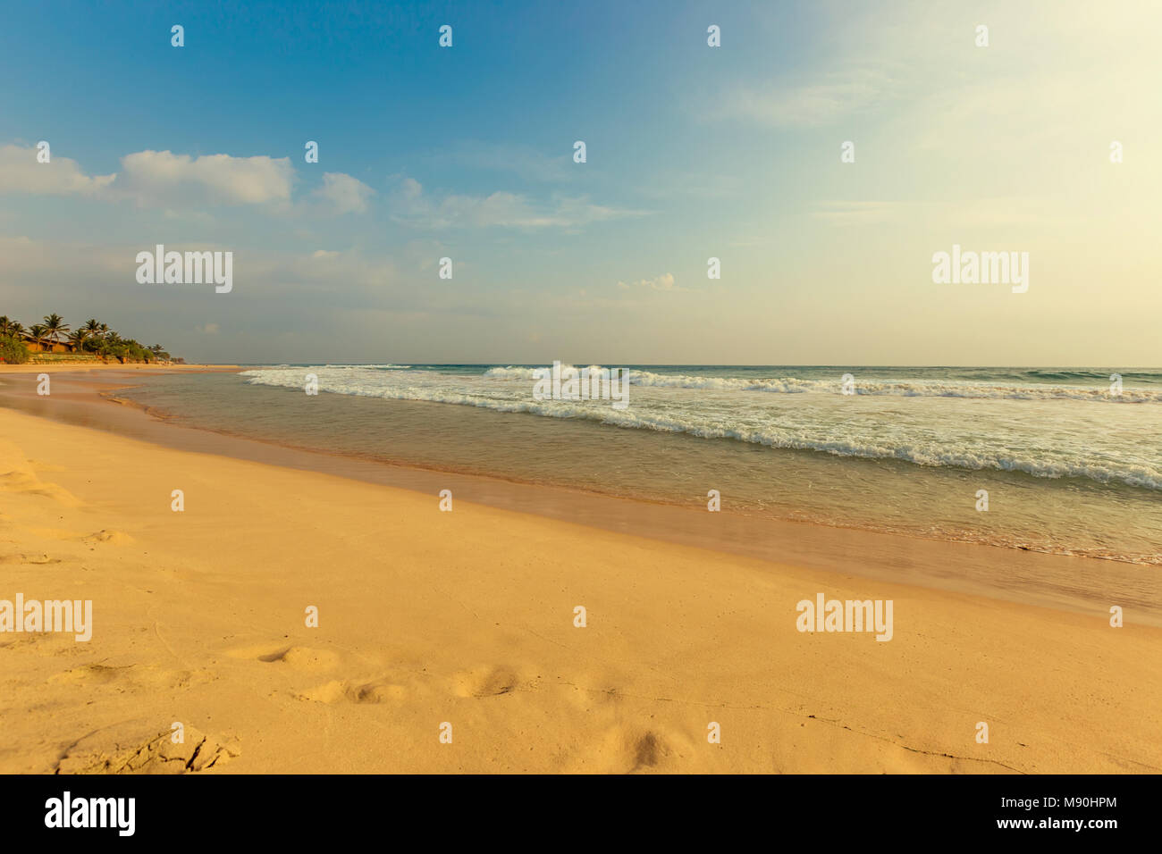 Landscape of sand beach and sea with blue sky Stock Photo - Alamy