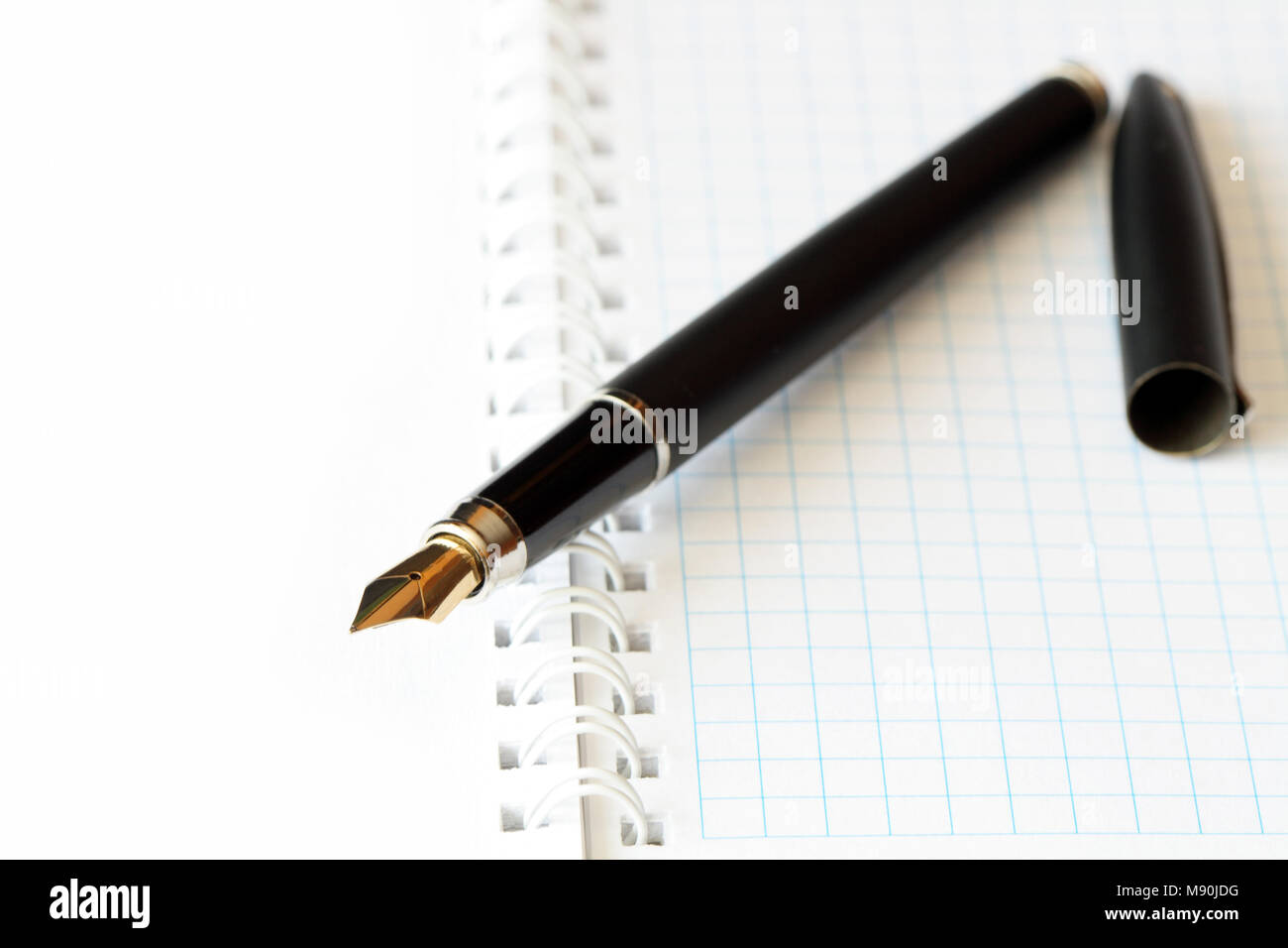 Closeup of fountain pen lying on open spiral notebook Stock Photo Alamy