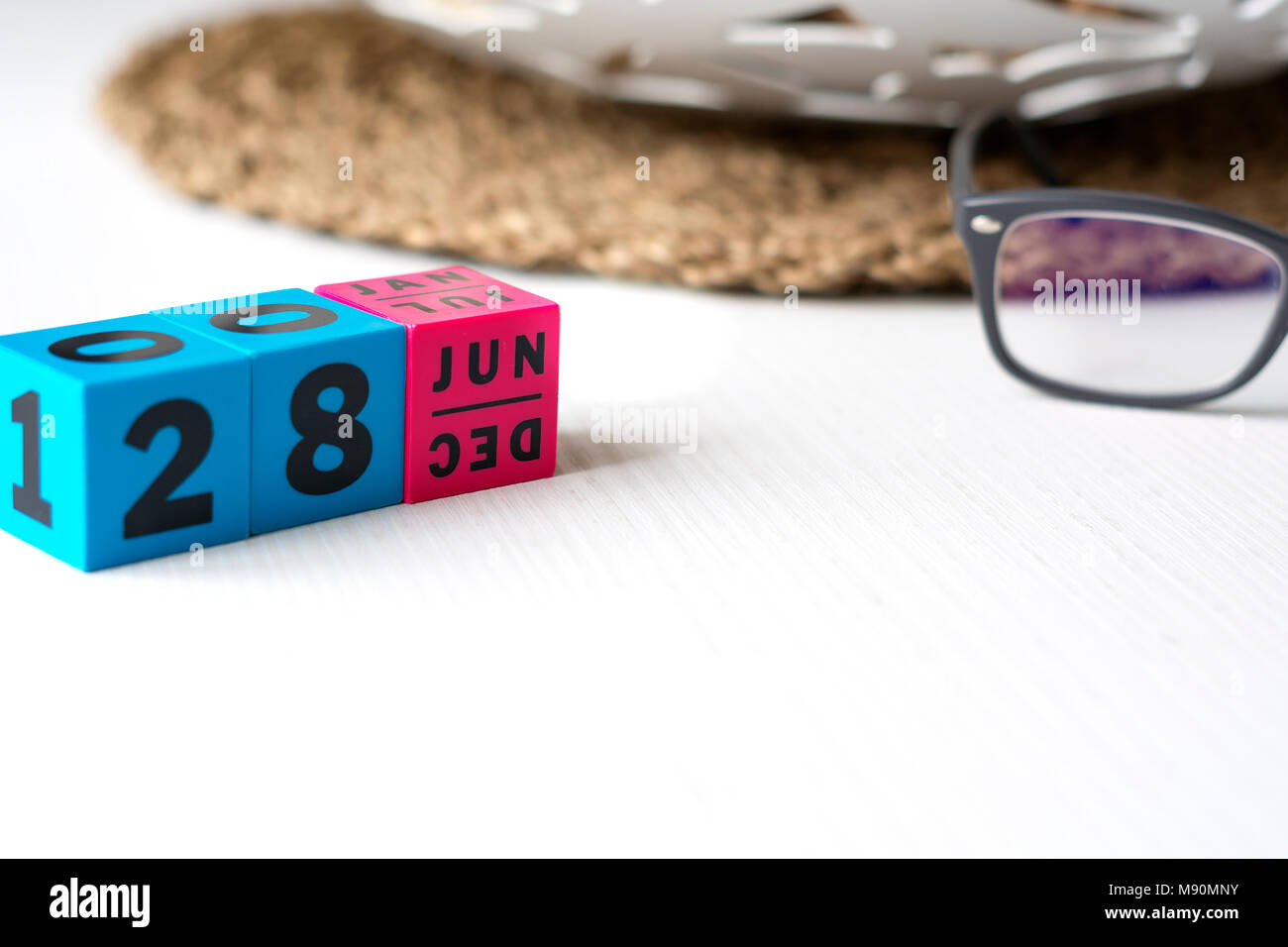 modern perpetual calendar composed of colored cubes and set at the date of June 28 Stock Photo