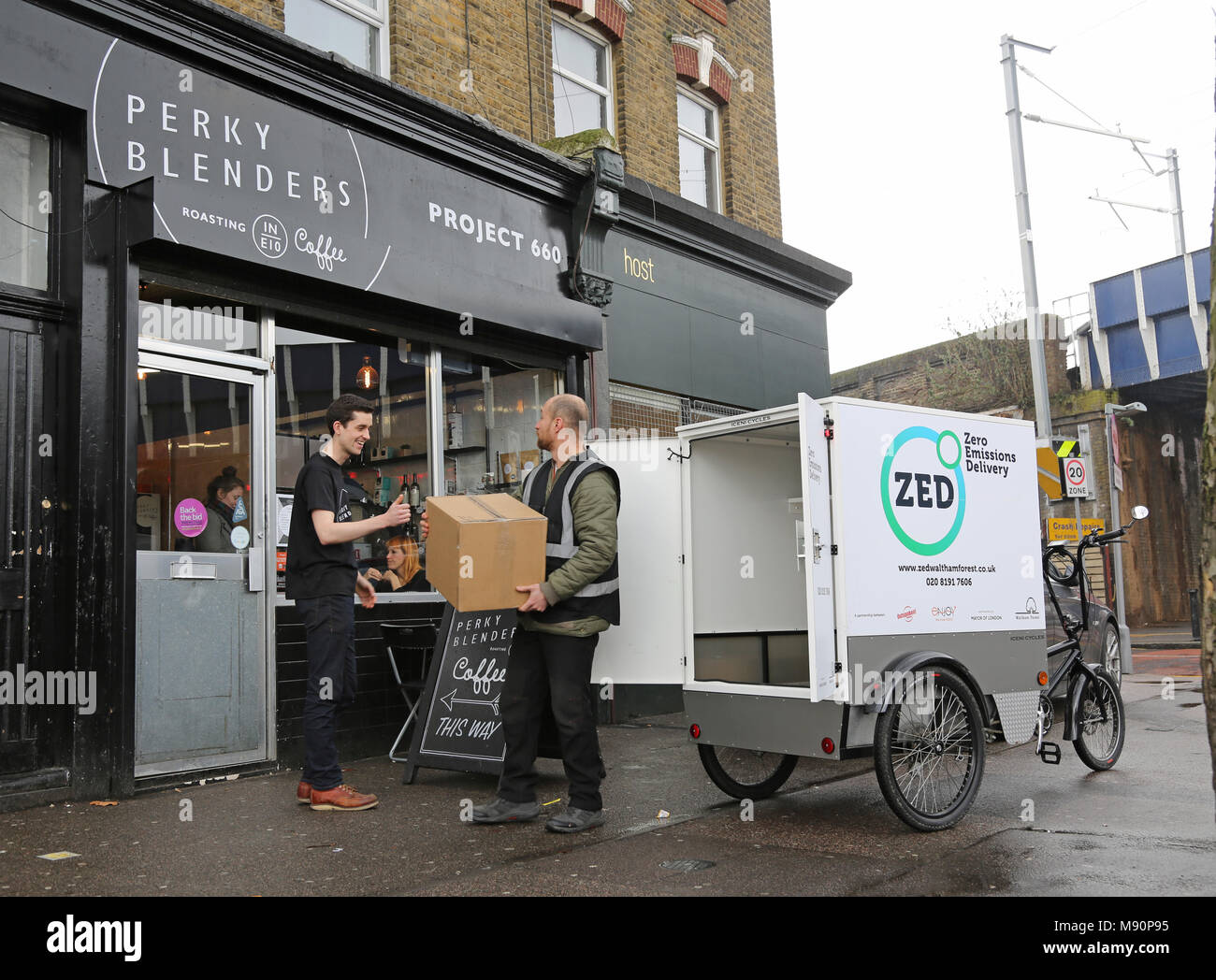 Staff from a Zero Emissions delivery company use an electric cargo trike to distribute goods in Walthamstow, North London. Stock Photo