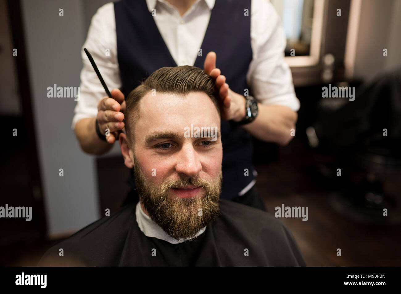 Portrait of happy man having hair cut at barber salon Stock Photo - Alamy Portrait of happy man having hair cut at barber salon Stock Photo - Alamy