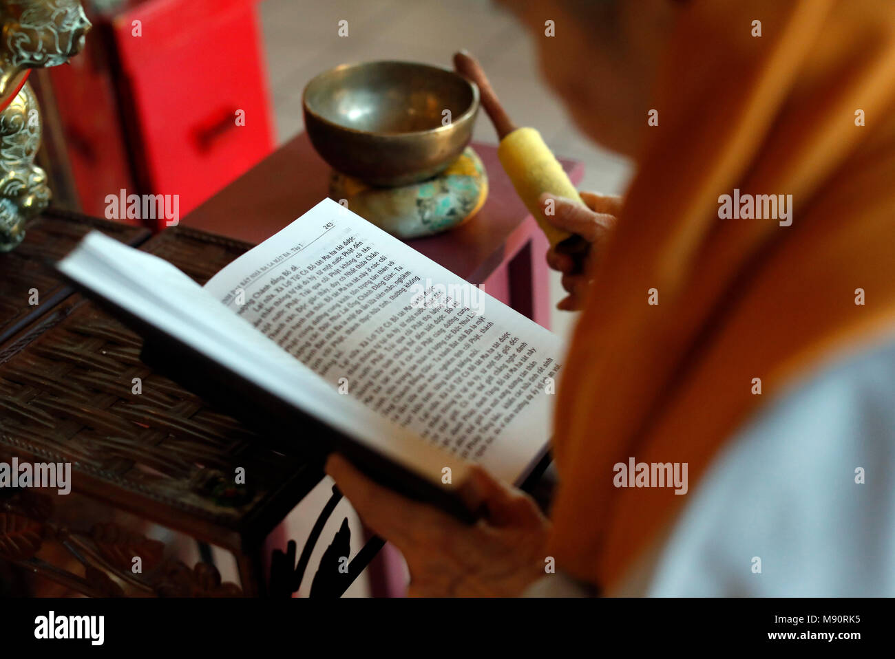 Tu An Buddhist temple.  Monk at buddhist ceremony. Buddhist book. Stock Photo