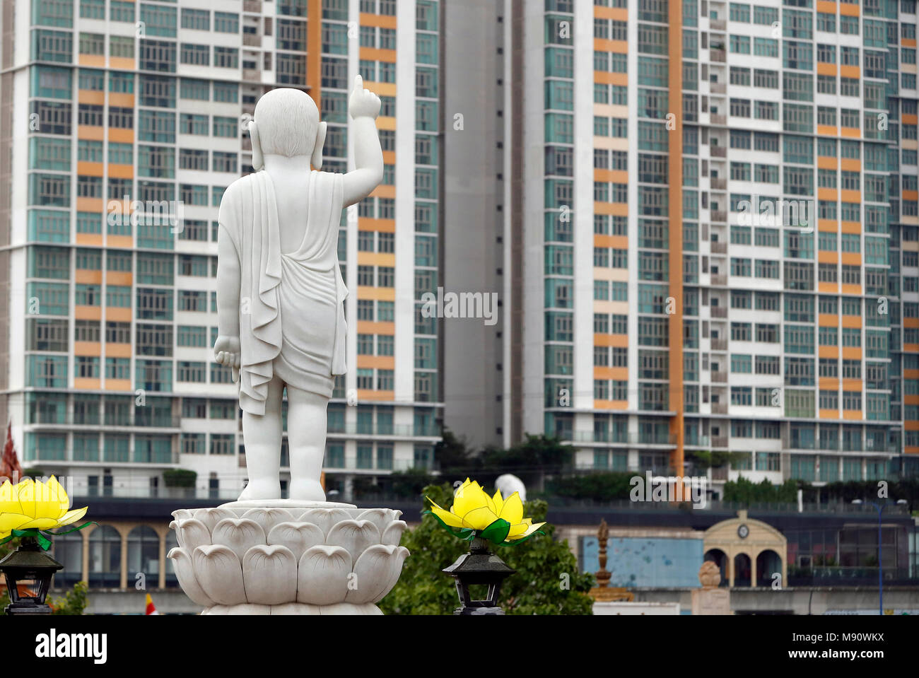 Minh Dang Quang buddhist temple.  Boy Buddha statue with long-ears, bald-headed and one finger pointing to the sky.  Ho Chi Minh city. Vietnam. Stock Photo