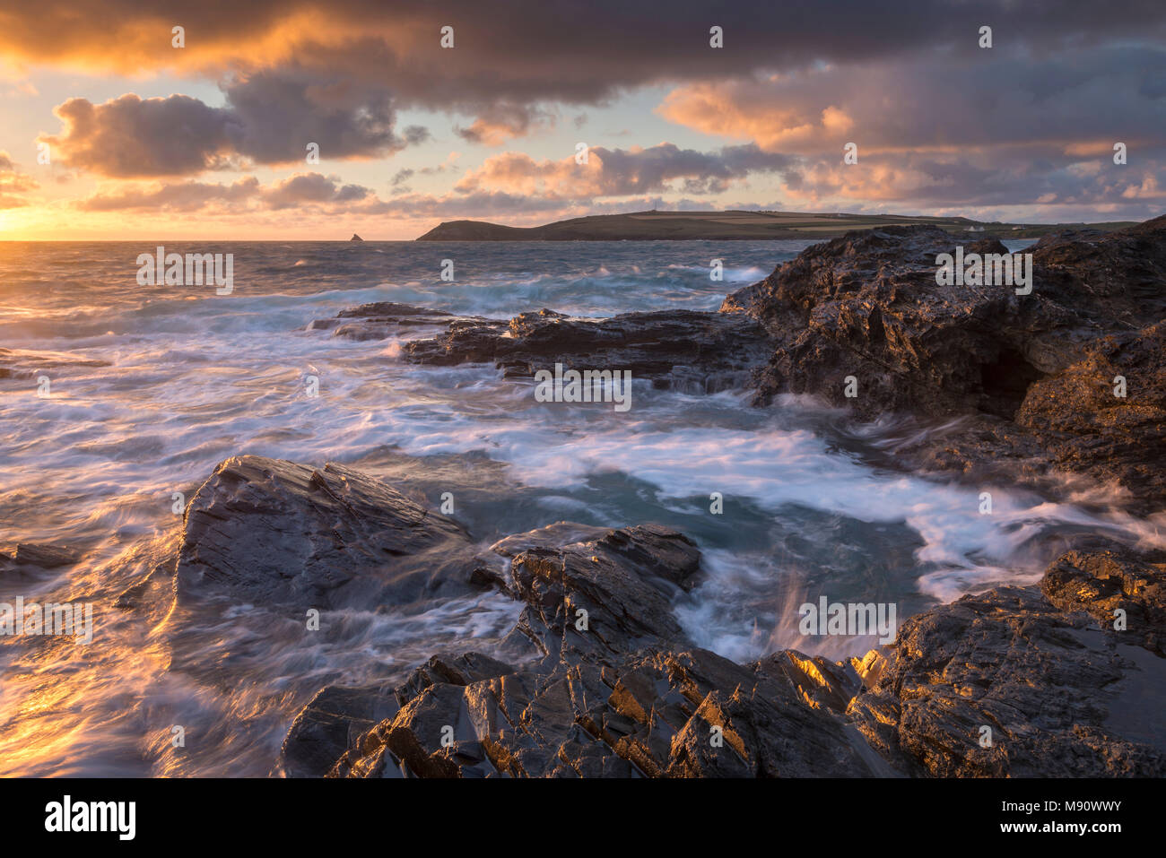 Waves crash against the rocky shores of Constantine Bay, looking towards Trevose Head, Cornwall. Summer (July) 2017. Stock Photo