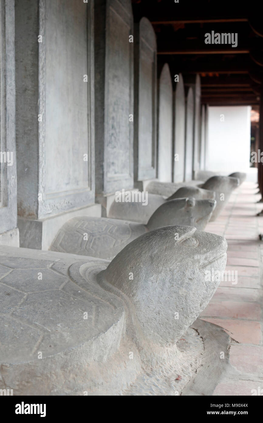 The Temple of Literature is Confucian temple which was formerly a center of learning in Hanoi.   Stelae of doctors  riding the backs of turtles.  Hano Stock Photo