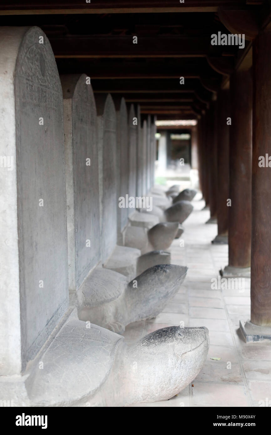 The Temple of Literature is Confucian temple which was formerly a center of learning in Hanoi.   Stelae of doctors  riding the backs of turtles.  Hano Stock Photo