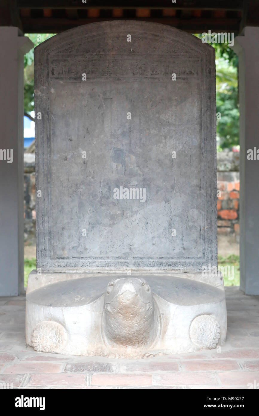 The Temple of Literature is Confucian temple which was formerly a center of learning in Hanoi.   Stelae of doctors  riding the back of turtle.  Hanoi. Stock Photo