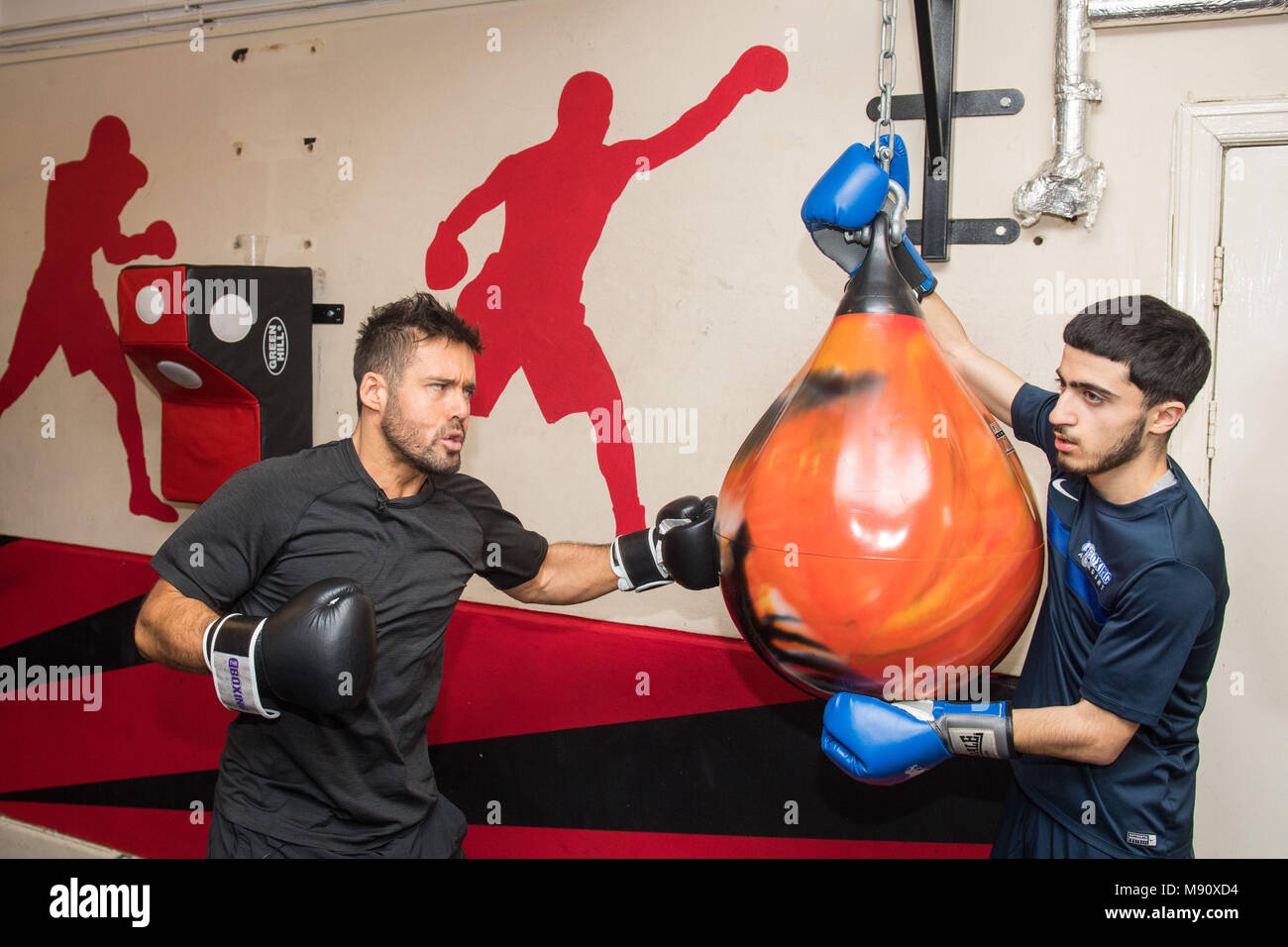 Embargoed to 0001 Thursday March 22 Previously unissued photo dated 13/03/18 of Spencer Matthews (left) during a visit to the Boxing Academy, a Comic Relief funded sport project in Hackney, London, ahead of Sport Relief boxing challenge. Stock Photo