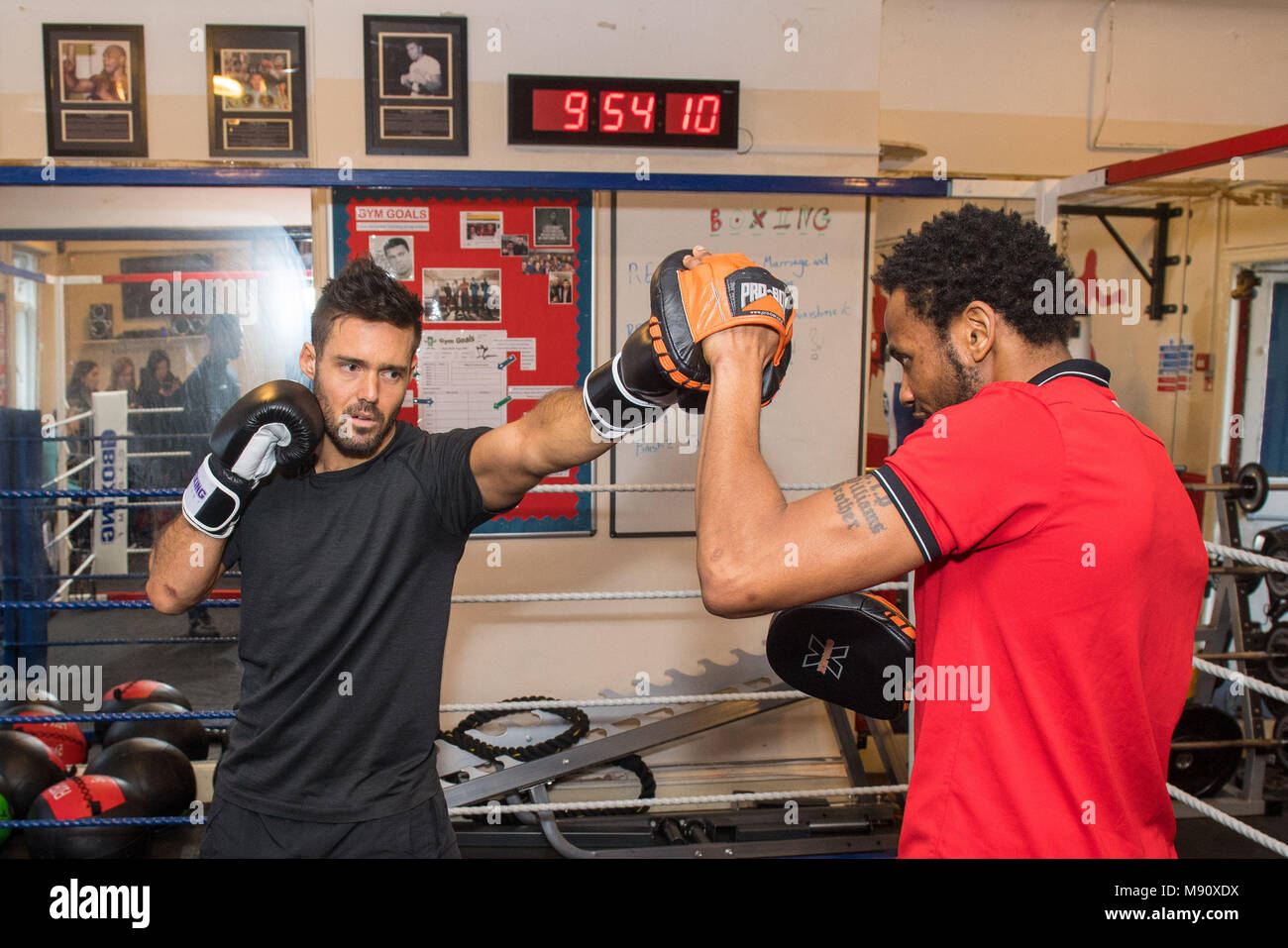 Embargoed to 0001 Thursday March 22 Previously unissued photo dated 13/03/18 of Spencer Matthews (left) taking part in a training session with coach Jermaine Williams, during a visit to the Boxing Academy, a Comic Relief funded sport project in Hackney, London, ahead of Sport Relief boxing challenge. Stock Photo