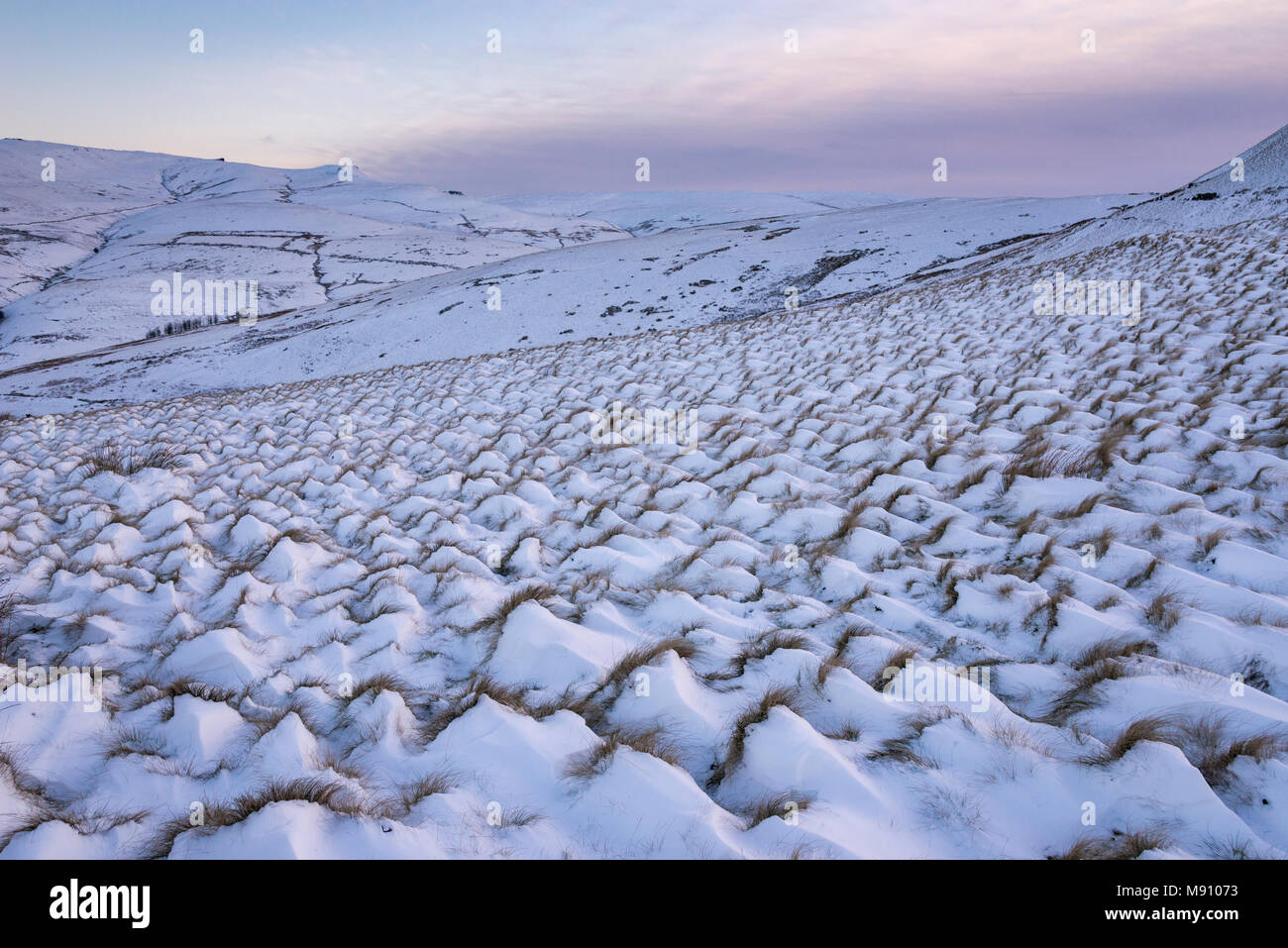 View of Kinder Scout from near Hayfield on a beautiful snowy morning in December. A moorland landscape in the Peak District, Derbyshire, England. Stock Photo