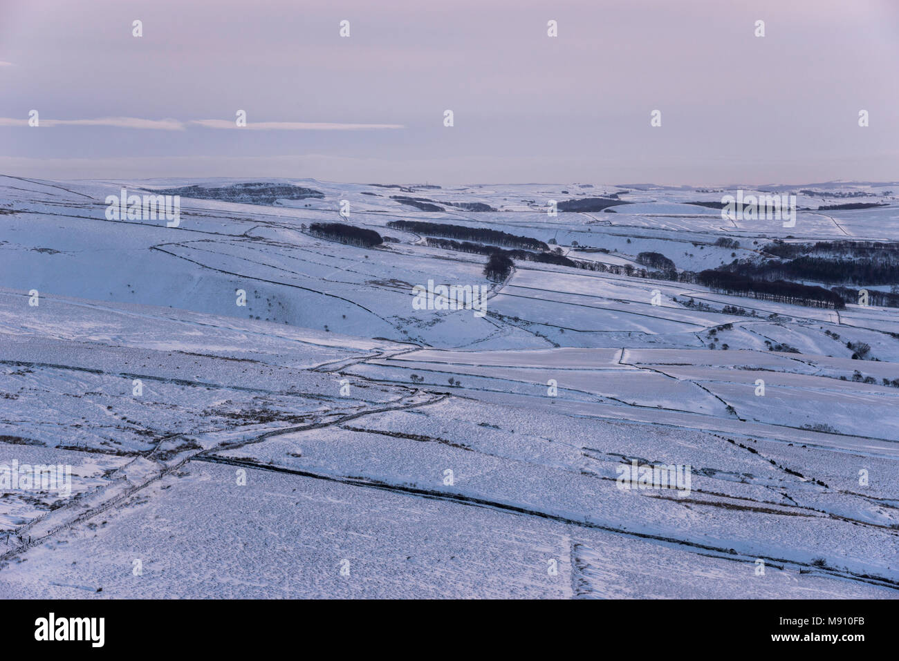 View over snow covered moors at South Head, Hayfield in the Peak