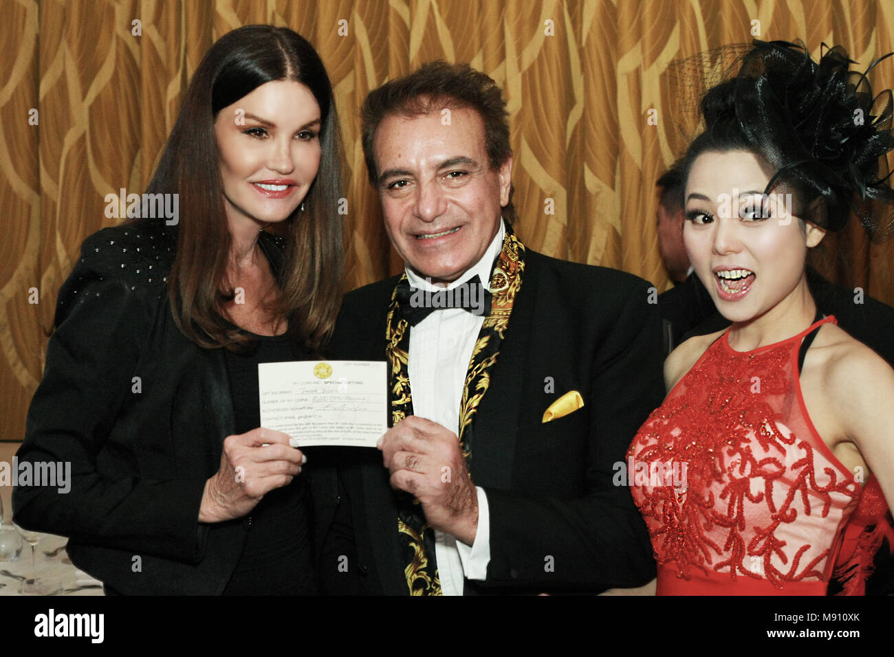 Janice Dickinson, Steven Nia, Angelina Leo at Wardour Studios Presents Hollywood Stars Gala Oscar Viewing Party 2018 at Waldorf Astoria, Beverly Hills Stock Photo